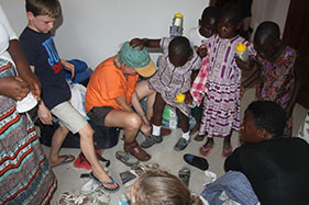 Fitting new shoes kindly donated by families at St. Andrews School, Pangbourne